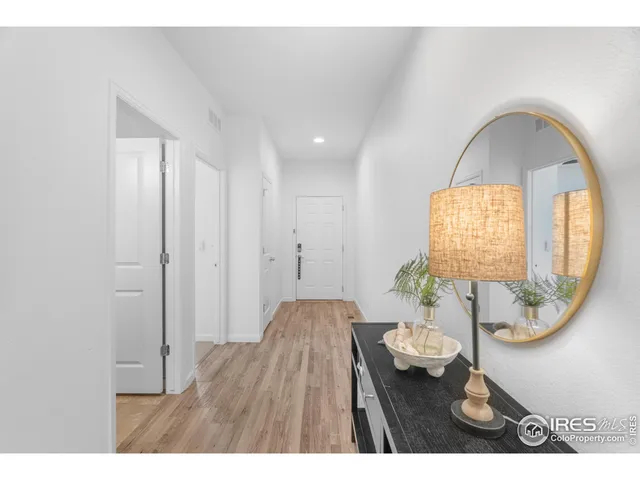 a view of a livingroom with furniture window and wooden floor