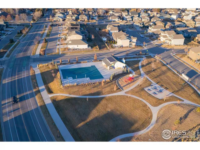 an aerial view of residential building and ocean