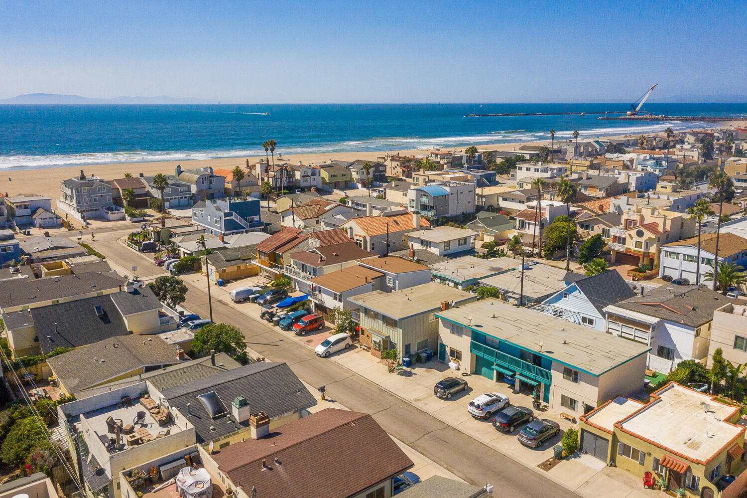 an aerial view of a building with beach