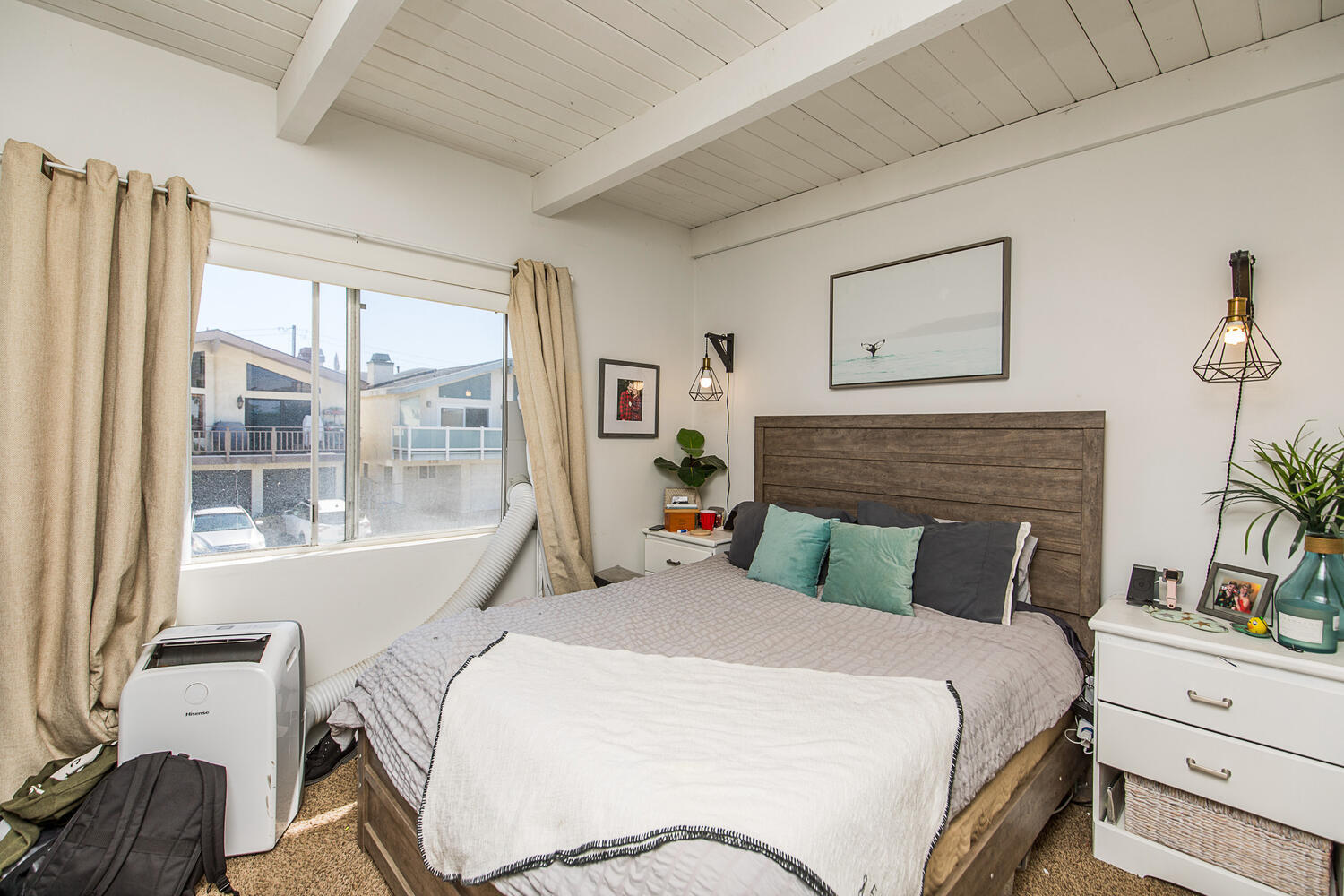 133 Burbank Avenue Oxnard, CA 93035 - Photo 11 of 40 a bedroom with a bed and wooden floor