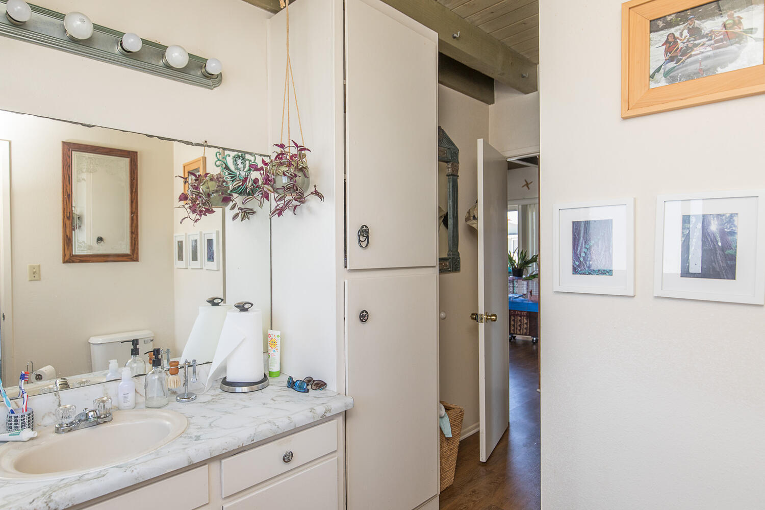 133 Burbank Avenue Oxnard, CA 93035 - Photo 22 of 40 a bathroom with a granite countertop sink and a mirror