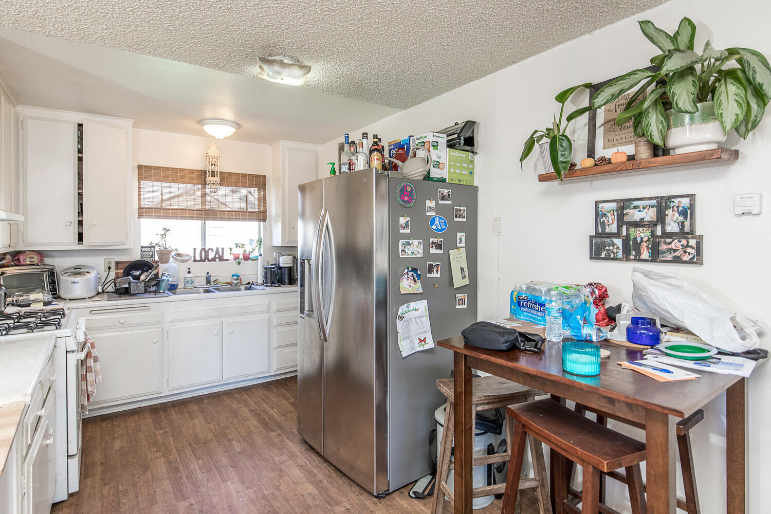133 Burbank Avenue Oxnard, CA 93035 - Photo 25 of 40 a kitchen with stainless steel appliances granite countertop a refrigerator and a stove top oven