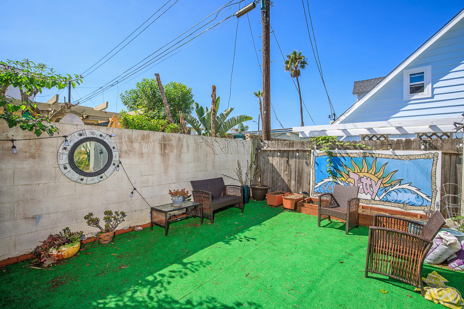 133 Burbank Avenue Oxnard, CA 93035 - Photo 31 of 40 a view of a chairs and table in backyard