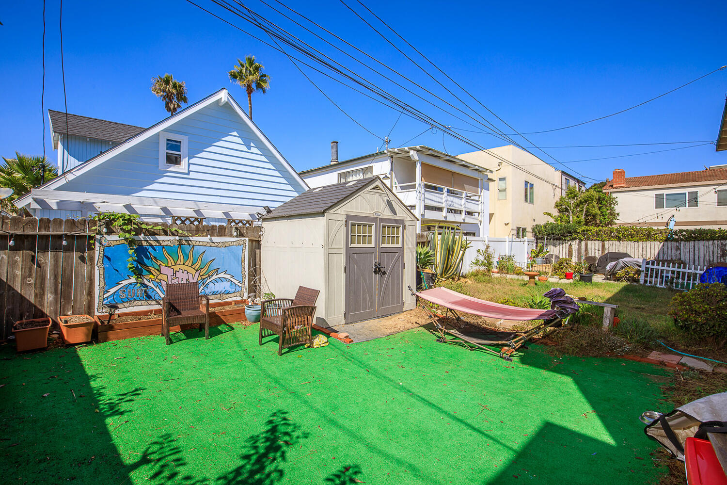 133 Burbank Avenue Oxnard, CA 93035 - Photo 32 of 40 a view of a chairs and table in backyard of the house