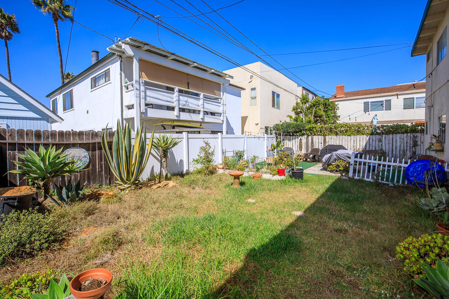 133 Burbank Avenue Oxnard, CA 93035 - Photo 33 of 40 a view of a house with a yard and potted plants