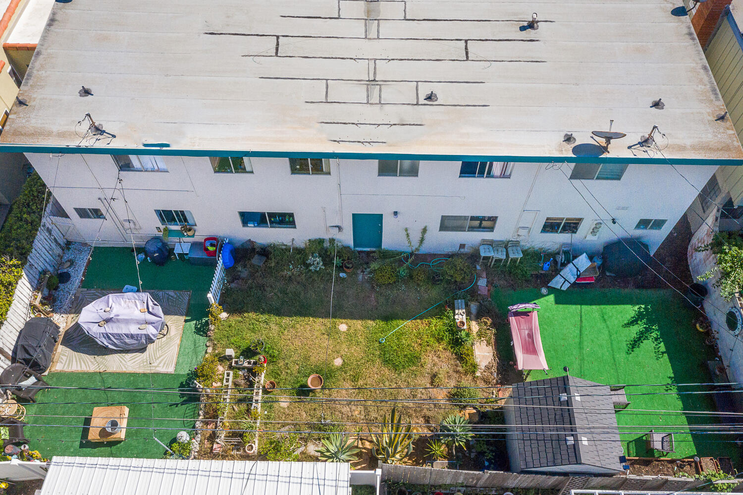 133 Burbank Avenue Oxnard, CA 93035 - Photo 38 of 40 a view of a patio with table and chairs potted plants