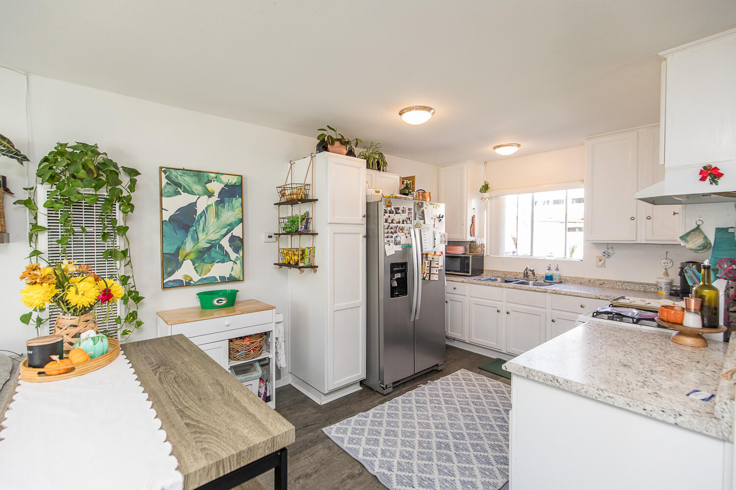 133 Burbank Avenue Oxnard, CA 93035 - Photo 6 of 40 a kitchen with stainless steel appliances kitchen island granite countertop a refrigerator and a sink