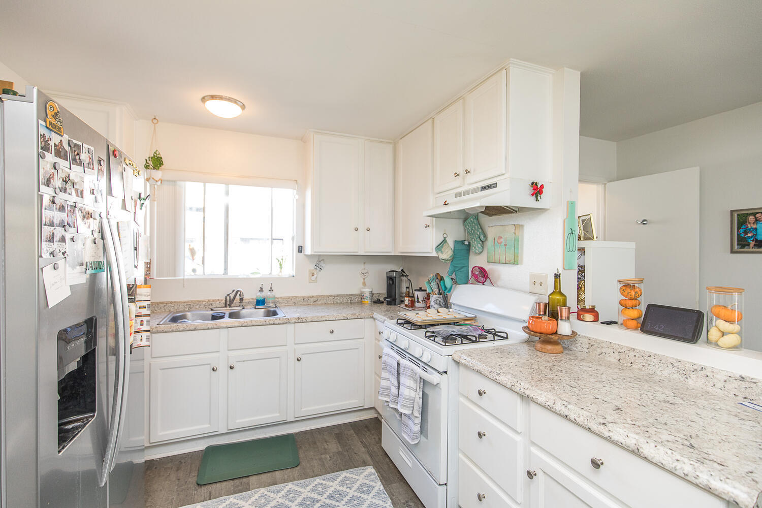 133 Burbank Avenue Oxnard, CA 93035 - Photo 7 of 40 a kitchen with stainless steel appliances white cabinets and a sink