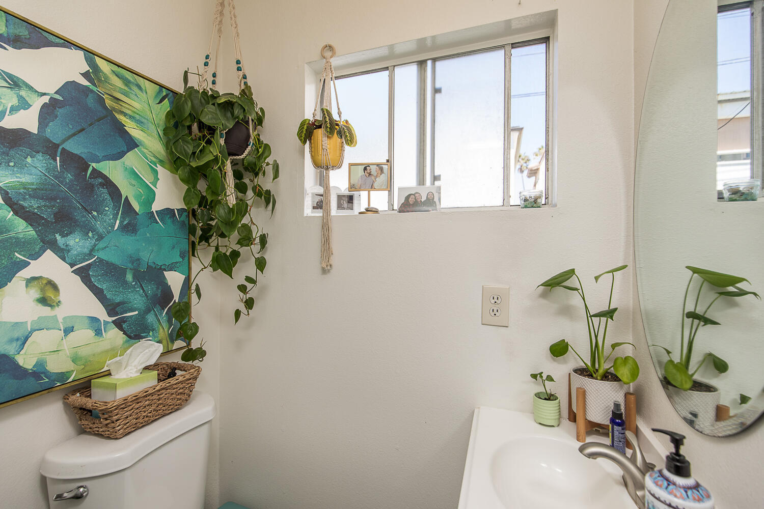 133 Burbank Avenue Oxnard, CA 93035 - Photo 10 of 40 a vase of flowers sitting on a table with window