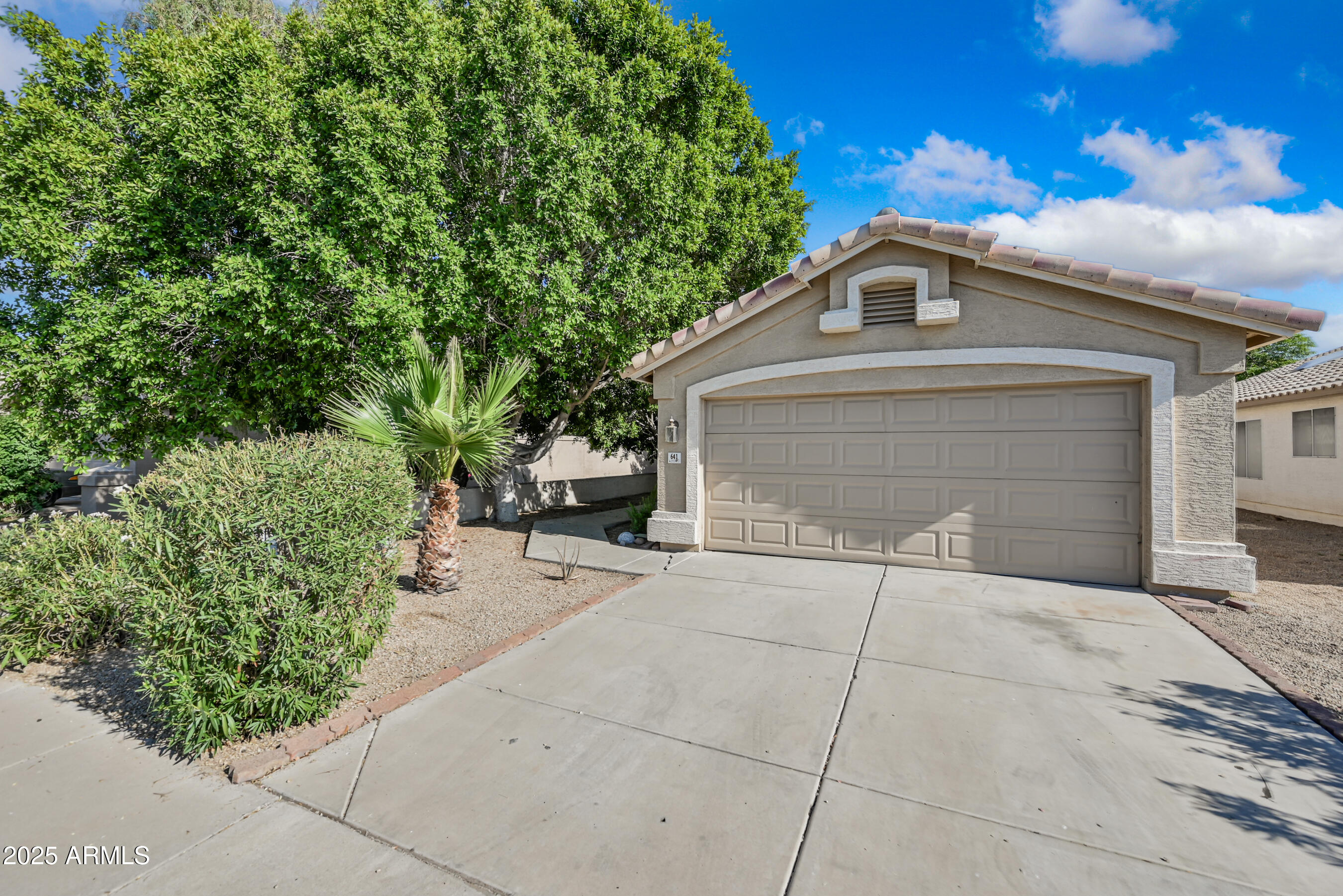 641 East Gail Drive Chandler, AZ 85225 - Photo 1 of 22 a front view of a house with a yard and garage