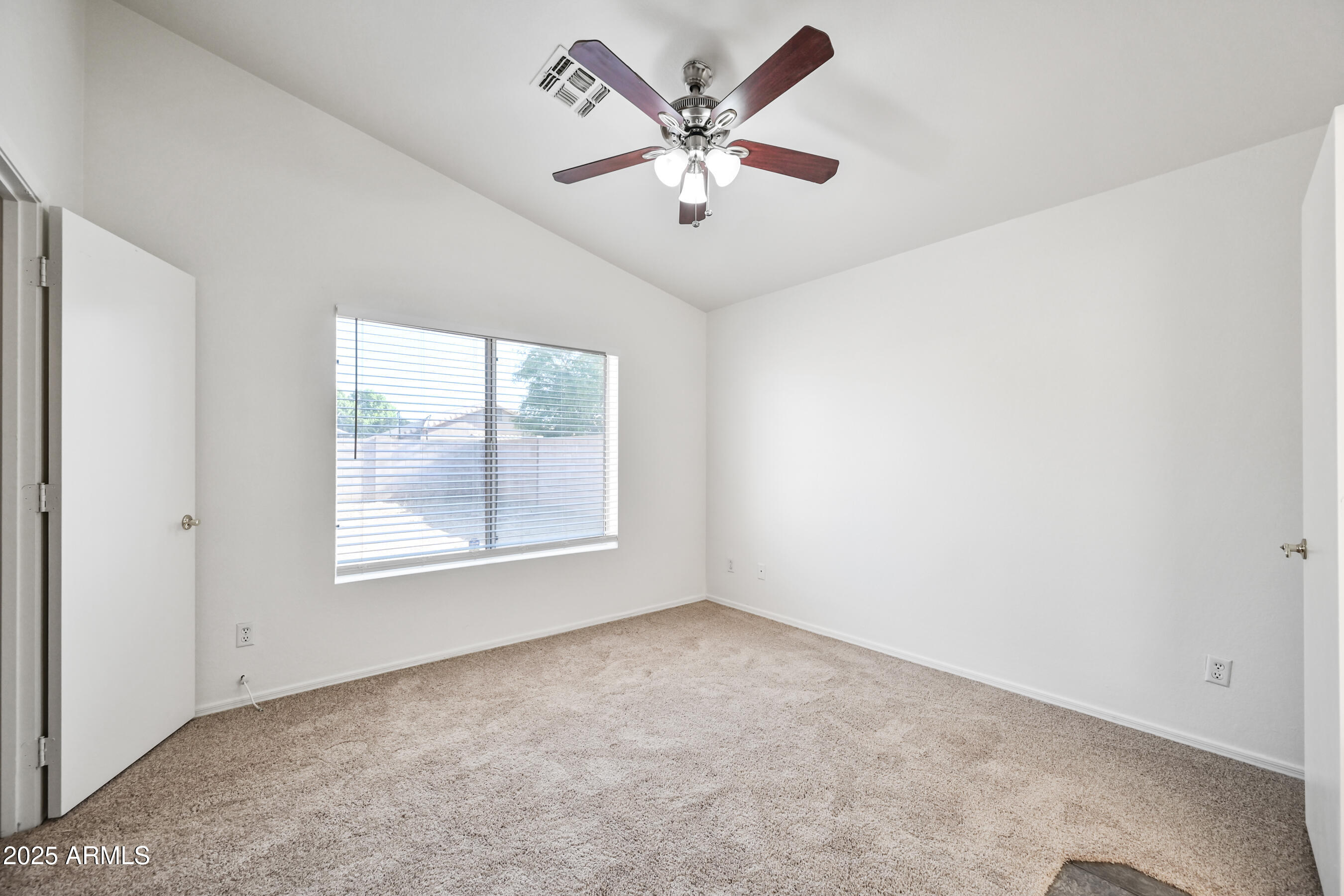 641 East Gail Drive Chandler, AZ 85225 - Photo 15 of 22 an empty room with windows and ceiling fan