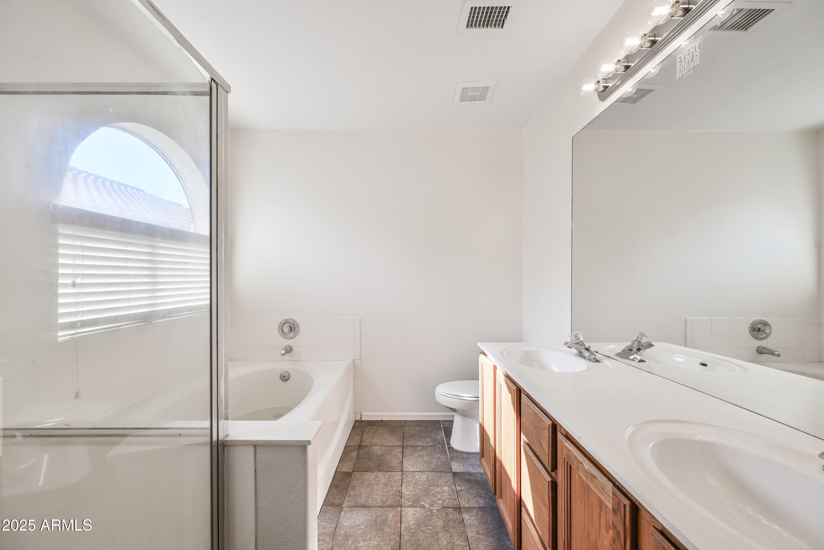 641 East Gail Drive Chandler, AZ 85225 - Photo 17 of 22 a bathroom with a sink a toilet and shower