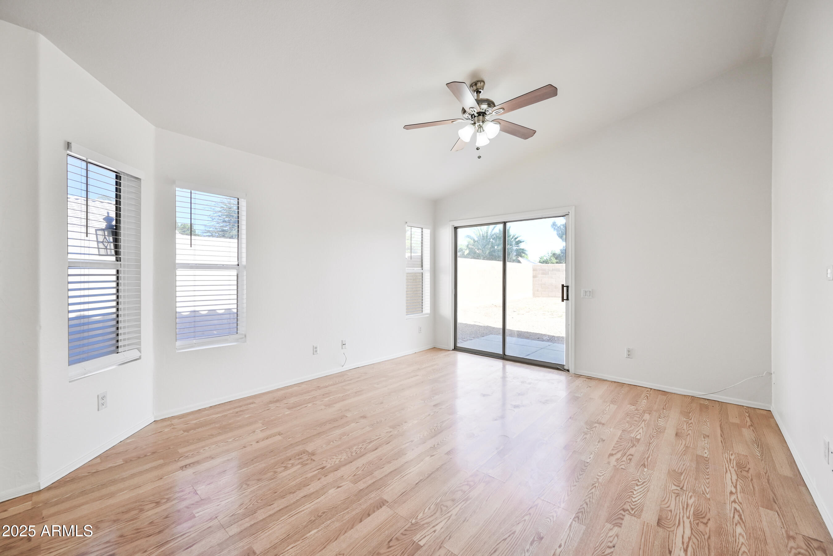 641 East Gail Drive Chandler, AZ 85225 - Photo 4 of 22 a view of an empty room with wooden floor and a window