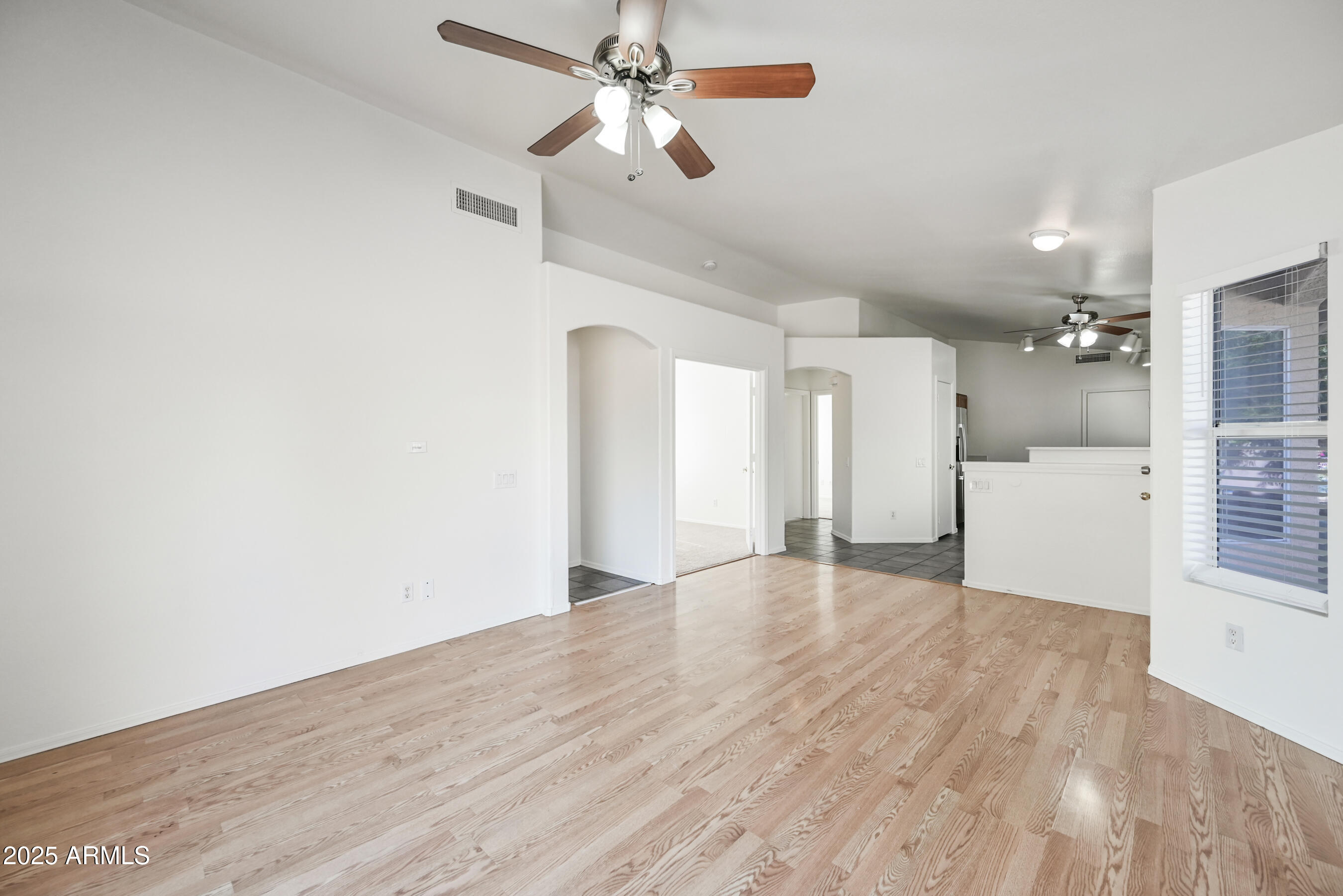 641 East Gail Drive Chandler, AZ 85225 - Photo 5 of 22 wooden floor in an empty room with a window