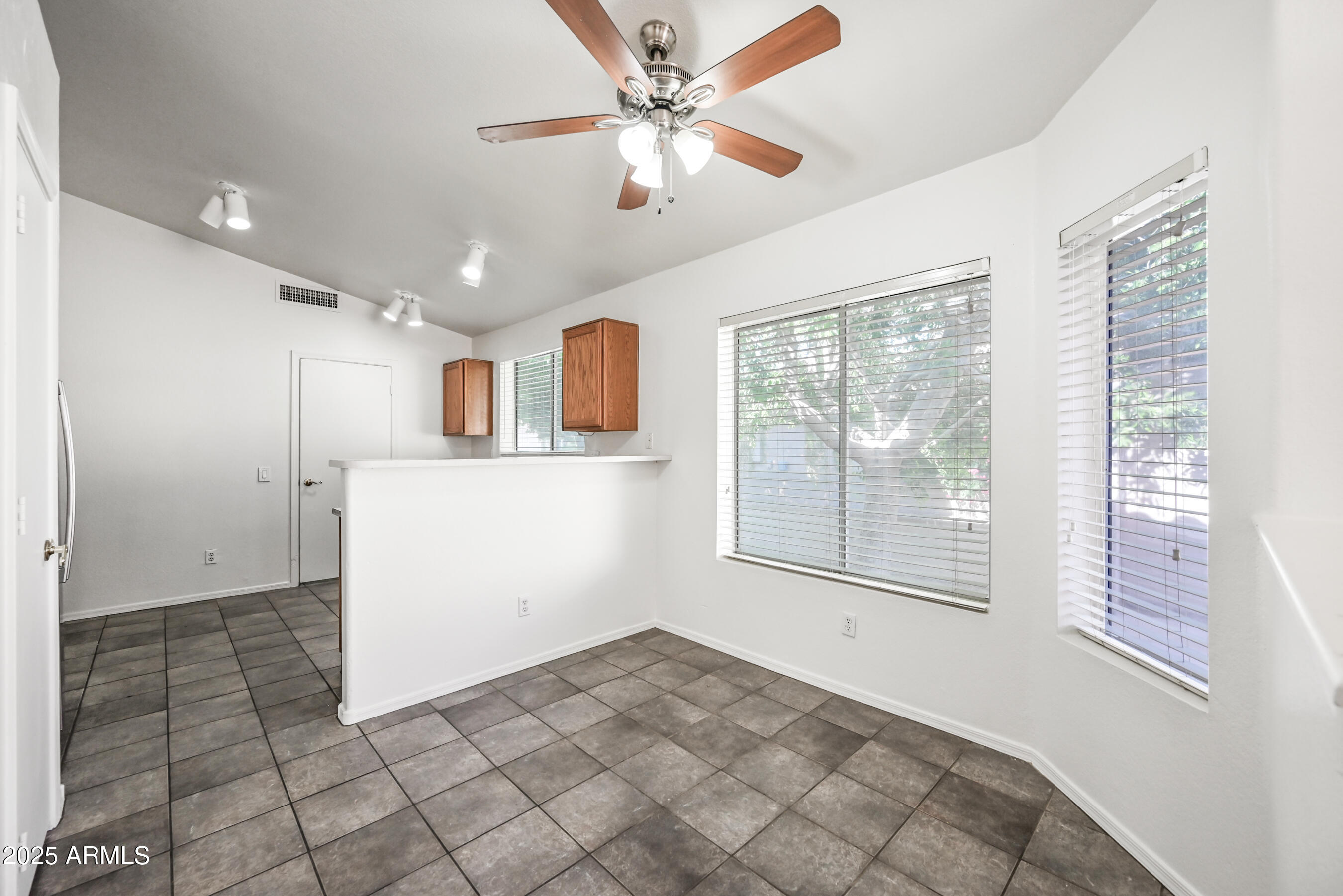 641 East Gail Drive Chandler, AZ 85225 - Photo 6 of 22 a view of a kitchen with furniture and a window