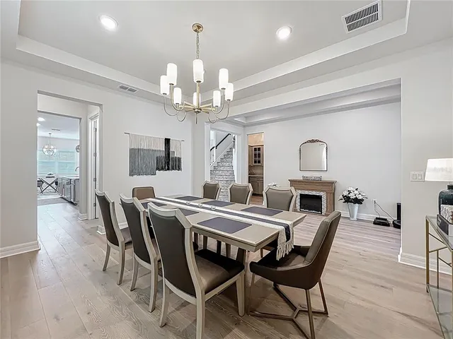 a kitchen with granite countertop a sink a stove and cabinets