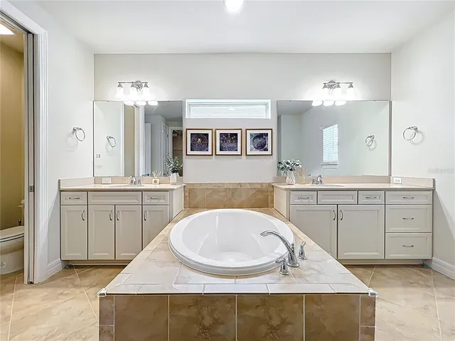 a bathroom with a sink a vanity and a mirror