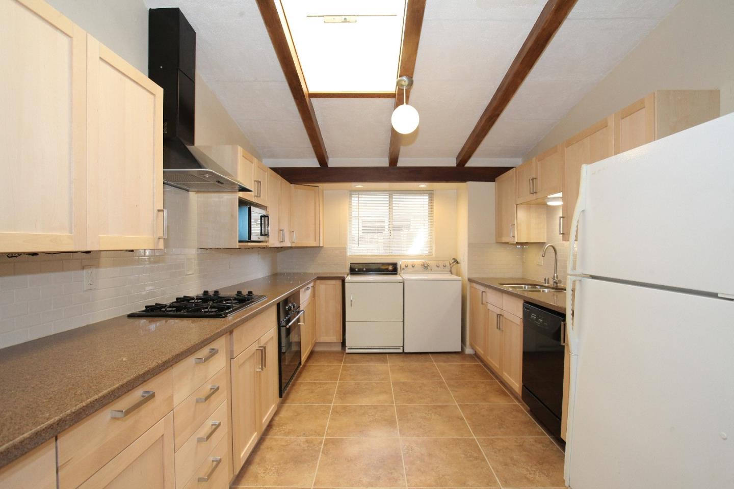 19100 Meiggs Lane Cupertino, CA 95014 - Photo 11 of 21 a kitchen with a sink a refrigerator and cabinets