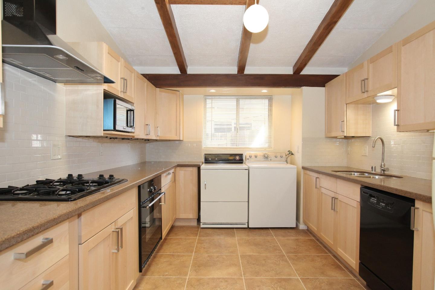 19100 Meiggs Lane Cupertino, CA 95014 - Photo 12 of 21 a kitchen with a stove sink and cabinets