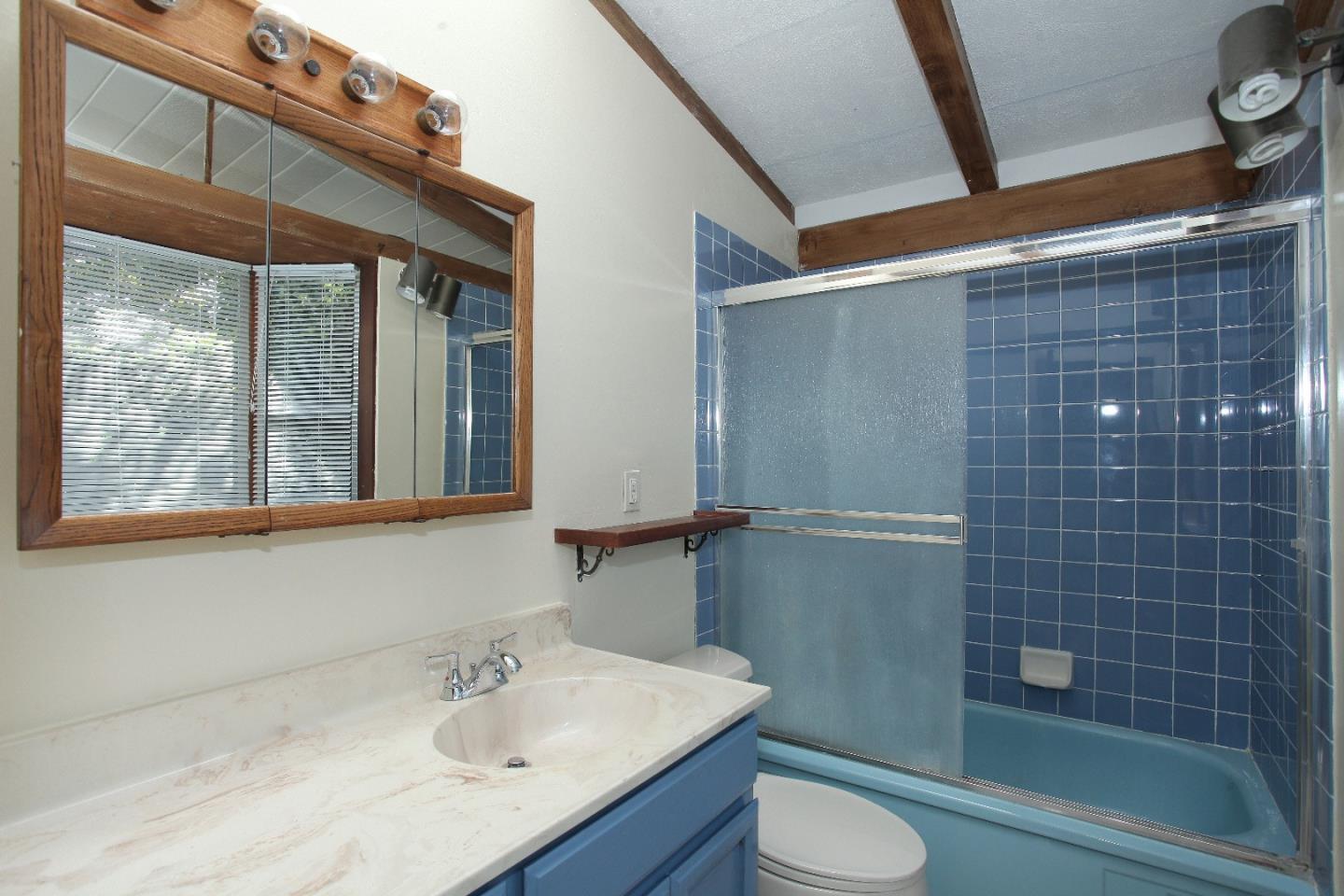 19100 Meiggs Lane Cupertino, CA 95014 - Photo 15 of 21 a bathroom with a sink a toilet and shower