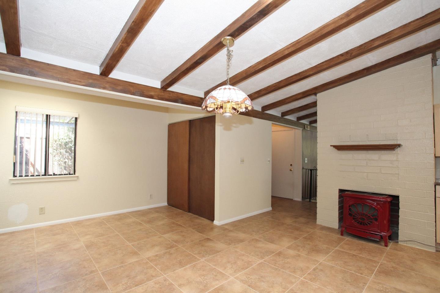 19100 Meiggs Lane Cupertino, CA 95014 - Photo 9 of 21 a view of an empty room with a fireplace