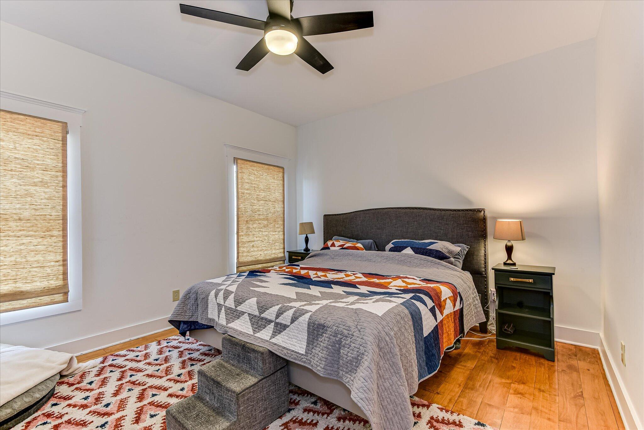1063 Colbert Bridge Road Aiken, SC 29803 - Photo 12 of 68 a bedroom with a bed and lamps