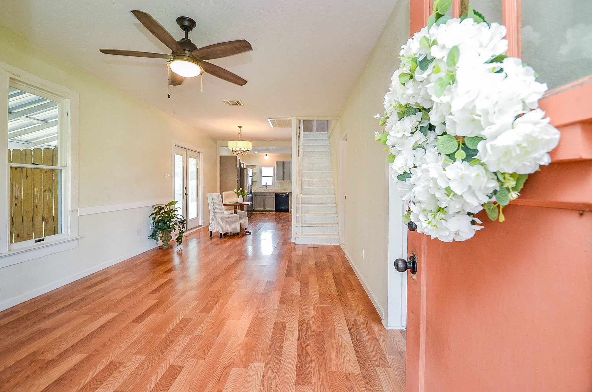 1615 Eagle Lake Road Sealy, TX 77474 - Photo 3 of 19 Open the door to this beautiful home with such character! Gorgeous laminate wood flooring flows throughout most of the home creating a seamless look!