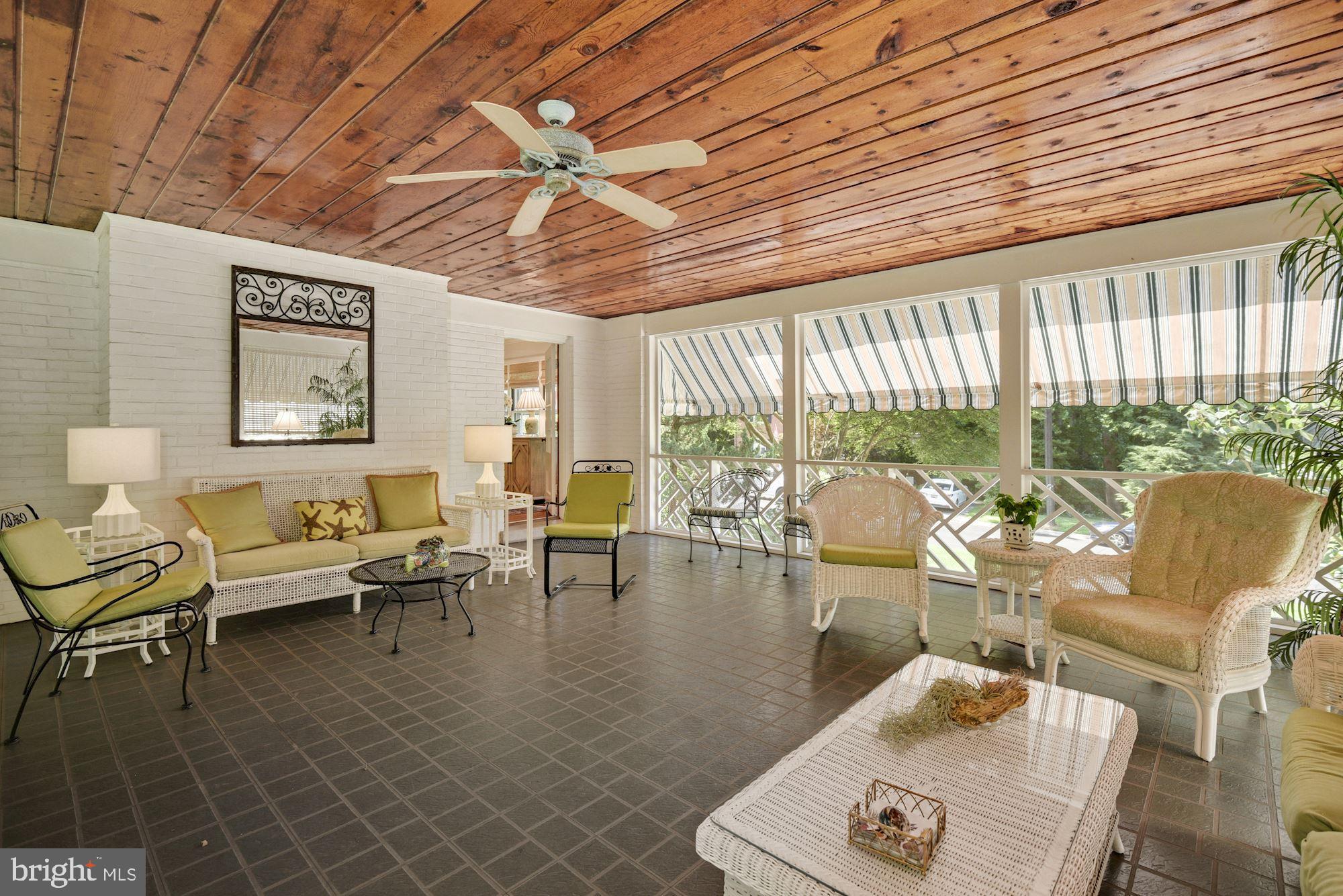 8213 Kerry Road Chevy Chase, MD 20815 - Photo 18 of 44 Wonderful, large Screened Porch with awnings