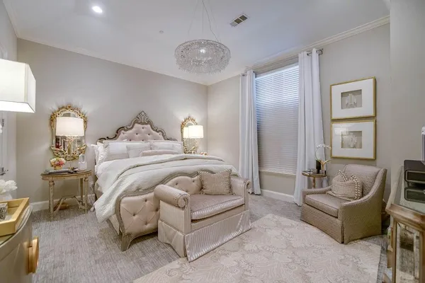 a bedroom with bed and a couch