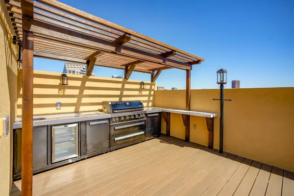 a kitchen with stainless steel appliances granite countertop a stove a sink and dishwasher