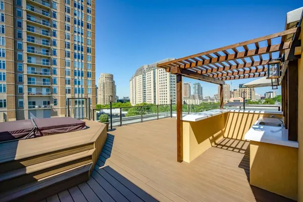 a view of swimming pool with seating area