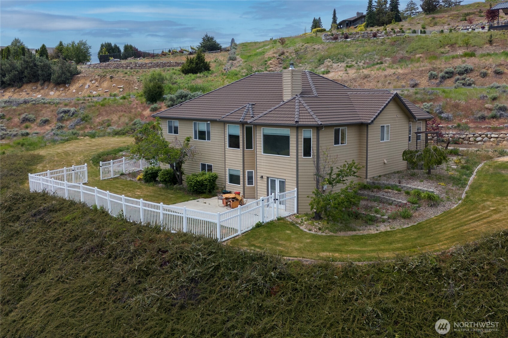 a view of house with garden space and street view
