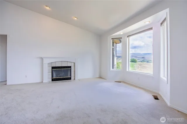 a view of an empty room with a window