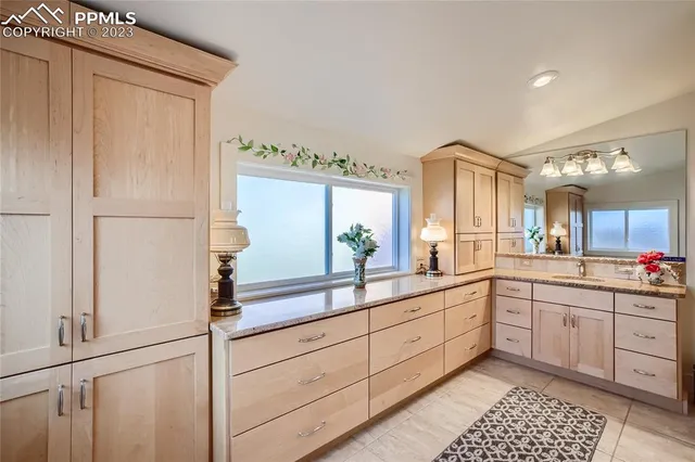 a large bathroom with a double vanity sink and mirror