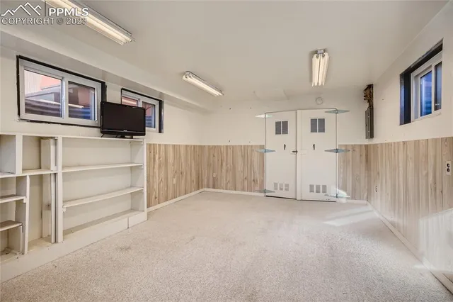 a view of an empty room with a window