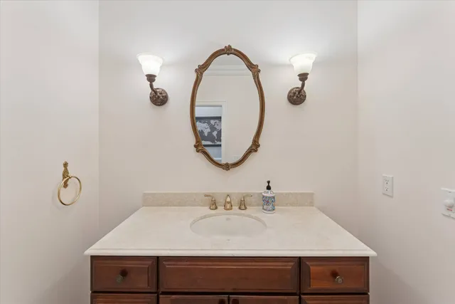 a bathroom with a sink and a mirror
