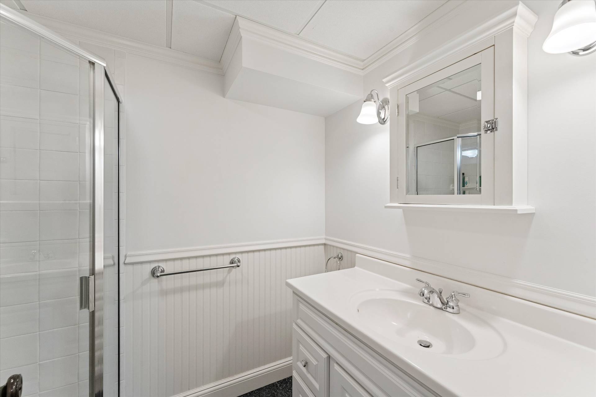 40 Overlook Drive Aquebogue, NY 11901 - Photo 24 of 32 a bathroom with a sink and mirror