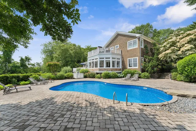 a view of swimming pool with lounge chair