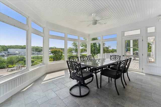 a view of a dining room with furniture window and outside view