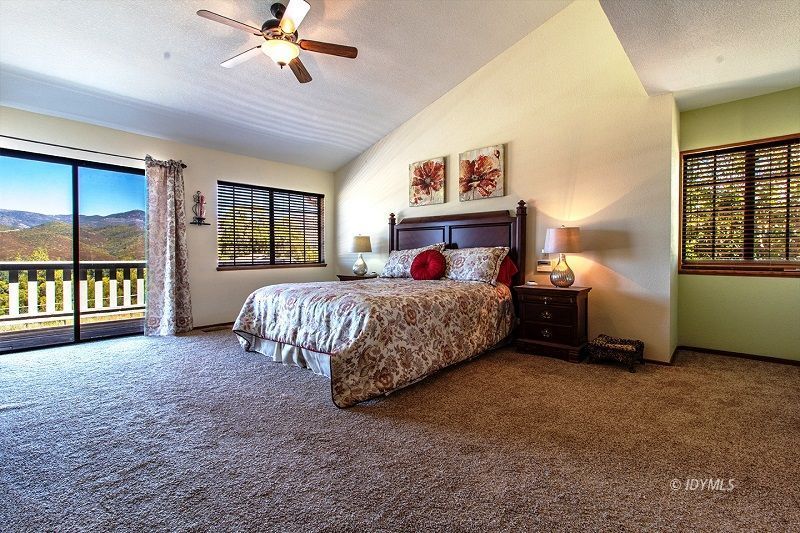 59382 Hop Patch Spring Road Mountain Center, CA 92561 - Photo 26 of 47 a bedroom with a bed dresser and a window