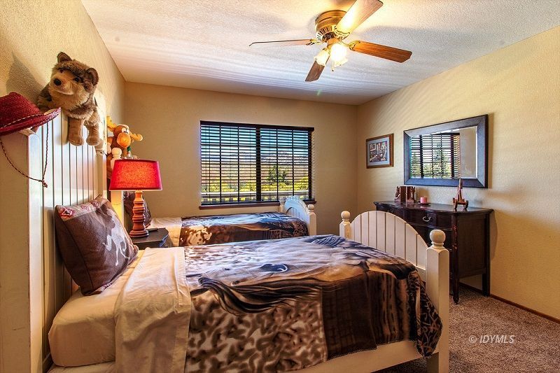 59382 Hop Patch Spring Road Mountain Center, CA 92561 - Photo 30 of 47 a bedroom with a bed and dresser with mirror