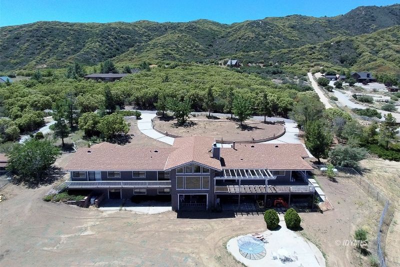 59382 Hop Patch Spring Road Mountain Center, CA 92561 - Photo 3 of 47 an aerial view of a house having yard swimming pool and a yard