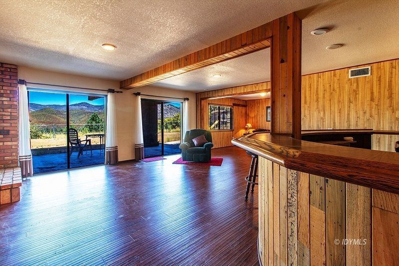 59382 Hop Patch Spring Road Mountain Center, CA 92561 - Photo 36 of 47 a view of a hallway with wooden floor and windows