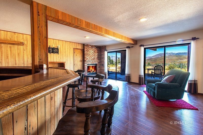 59382 Hop Patch Spring Road Mountain Center, CA 92561 - Photo 38 of 47 a view of a dining room with furniture window and wooden floor