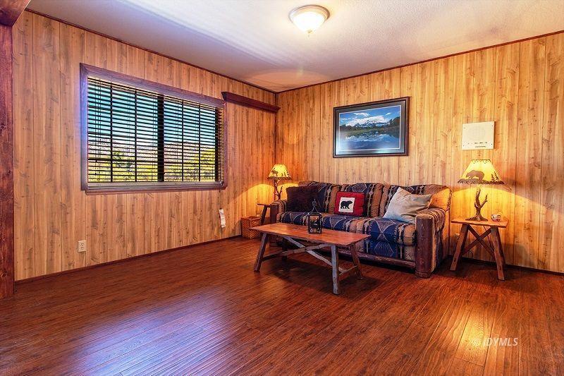 59382 Hop Patch Spring Road Mountain Center, CA 92561 - Photo 39 of 47 a living room with furniture and a wooden floor