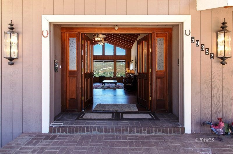 59382 Hop Patch Spring Road Mountain Center, CA 92561 - Photo 7 of 47 a view of a entryway door of the house