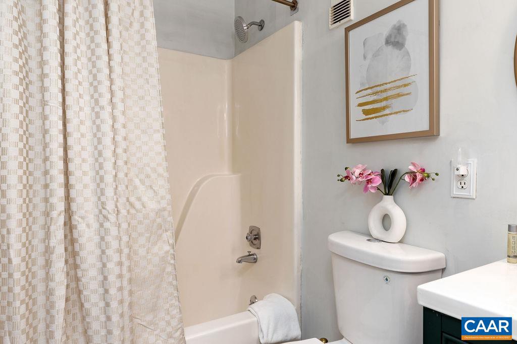 490 Three Ridges Roseland, VA 22967 - Photo 20 of 27 a bathroom with a toilet and a shower curtain