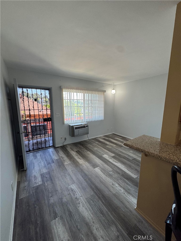 3136 Perlita Avenue, Unit 1 Atwater Village, CA 90039 - Photo 2 of 10 an empty room with wooden floor and windows