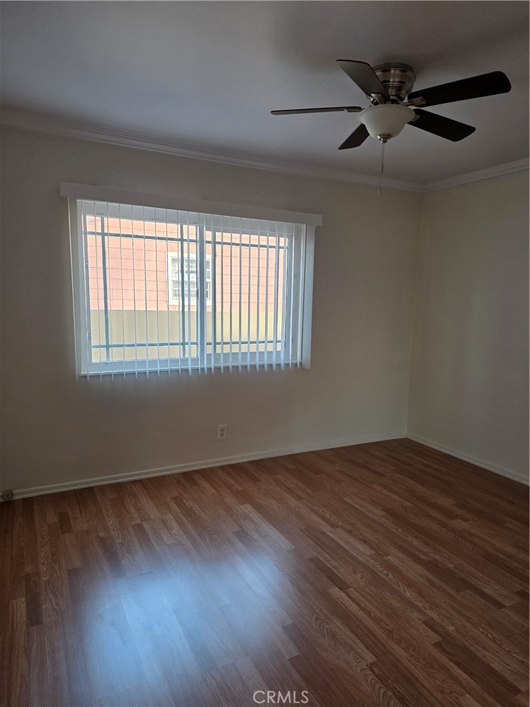 3136 Perlita Avenue, Unit 1 Atwater Village, CA 90039 - Photo 4 of 10 an empty room with wooden floor fan and windows