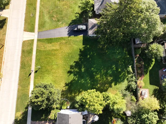 a view of a swimming pool with a yard